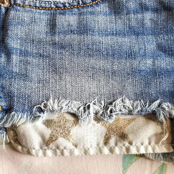 American Eagle High Waist Cut-Off Denim Shorts with Silver Glitter Star Pockets - Picture 3 of 9